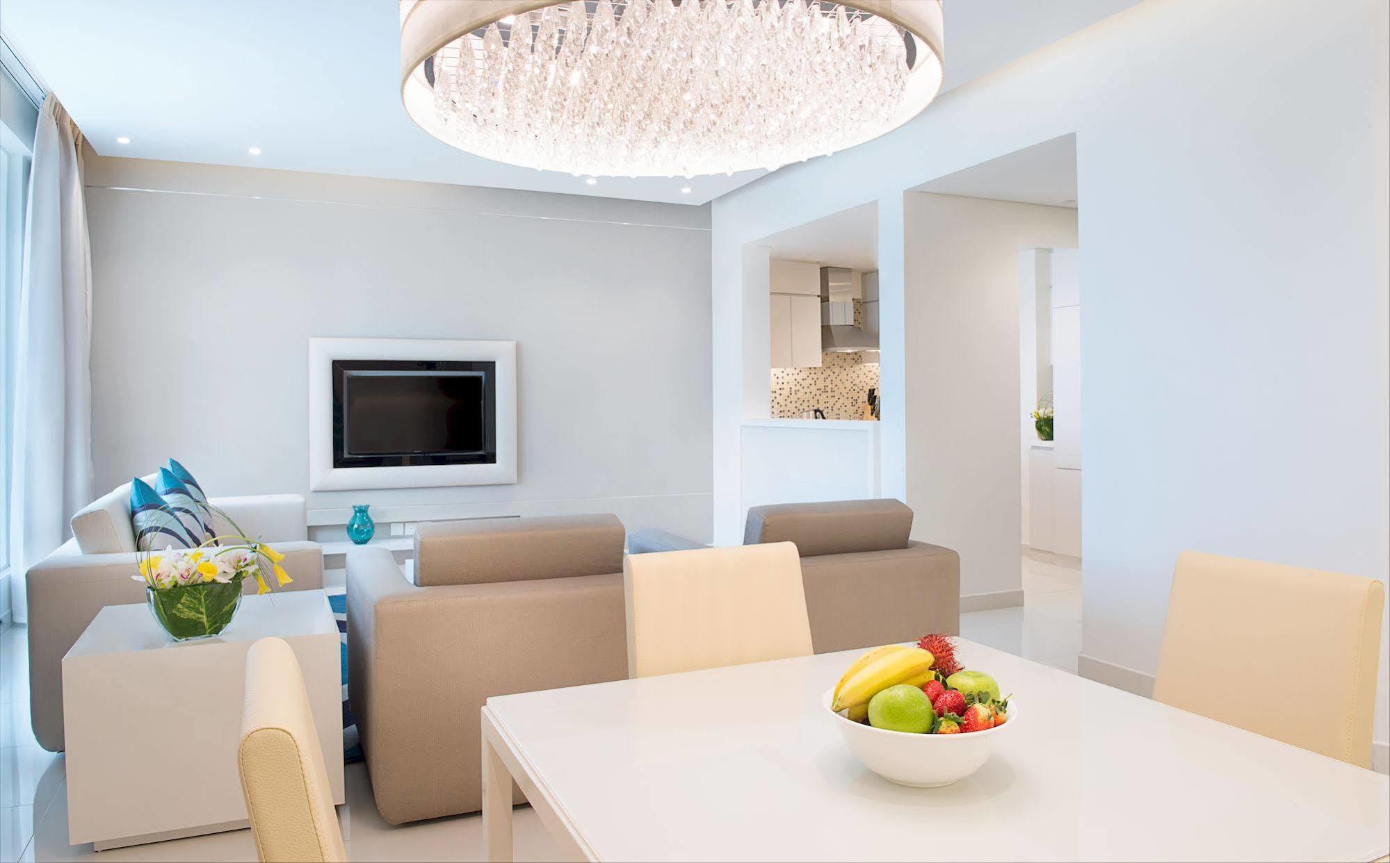 Damac Maison The Vogue Dubai Ngoại thất bức ảnh A living room with a flat screen television