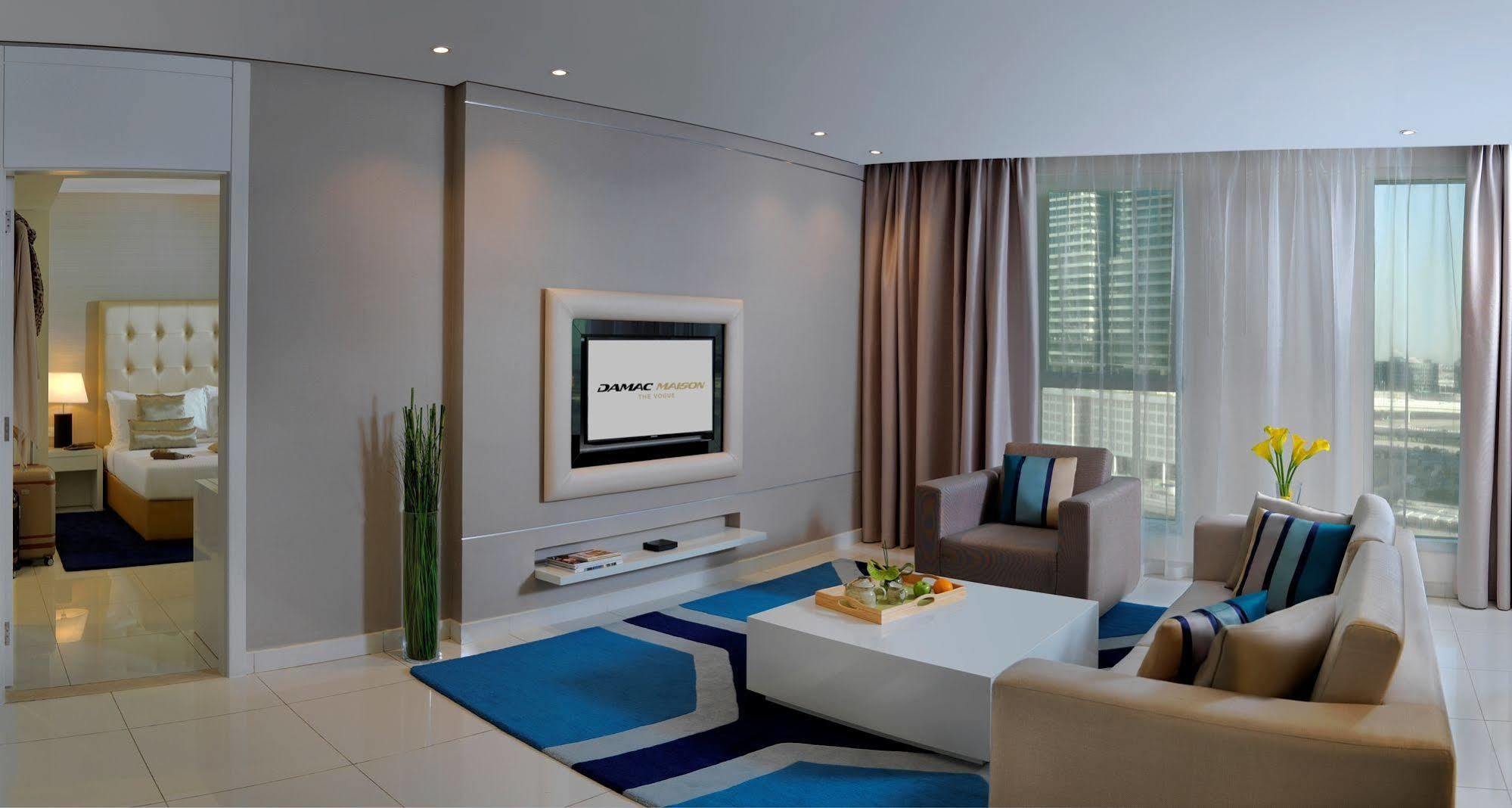 Damac Maison The Vogue Dubai Ngoại thất bức ảnh A living room with a television